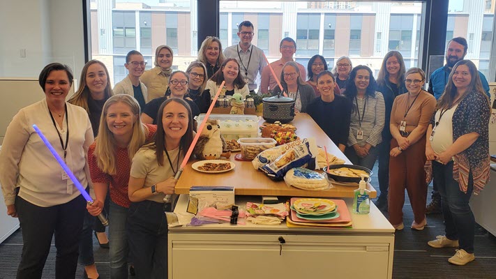 Teams enjoy formal and informal celebrations, like this 'May the 4th Be With You' lunch.